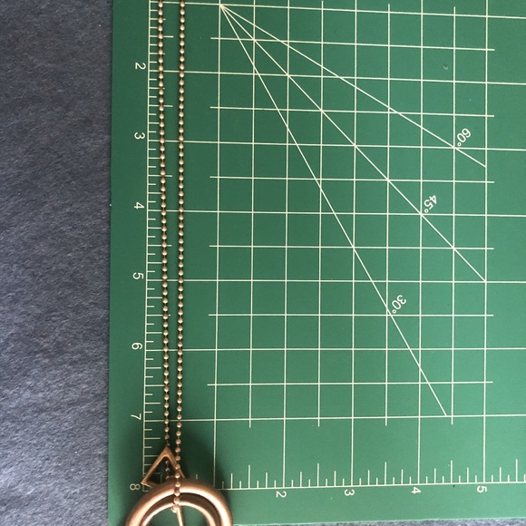 Necklace, earrings and bangle with free-floating geometric shapes as charms - Picture 6 of 12